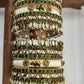 Ambal Glow White Lotus Kundan Bangles – Ivory, Emerald Green and Gold | Padikkai