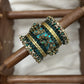 Peacock Prabhavam Gold Lotus Bangle Set – Peacock green and Gold | Padikkai