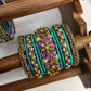 Suvarna Pushpam Kundan Bangles – Teal, Purple and Antique Gold | Padikkai